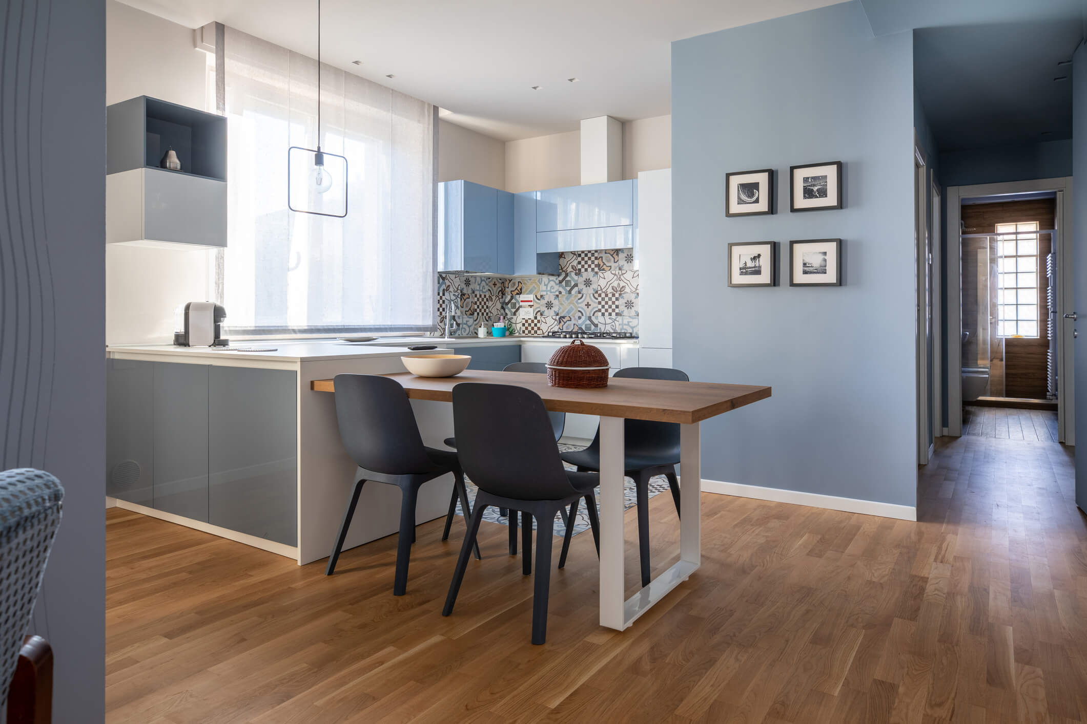 Modern open concept kitchen and dining area with contemporary furnishings