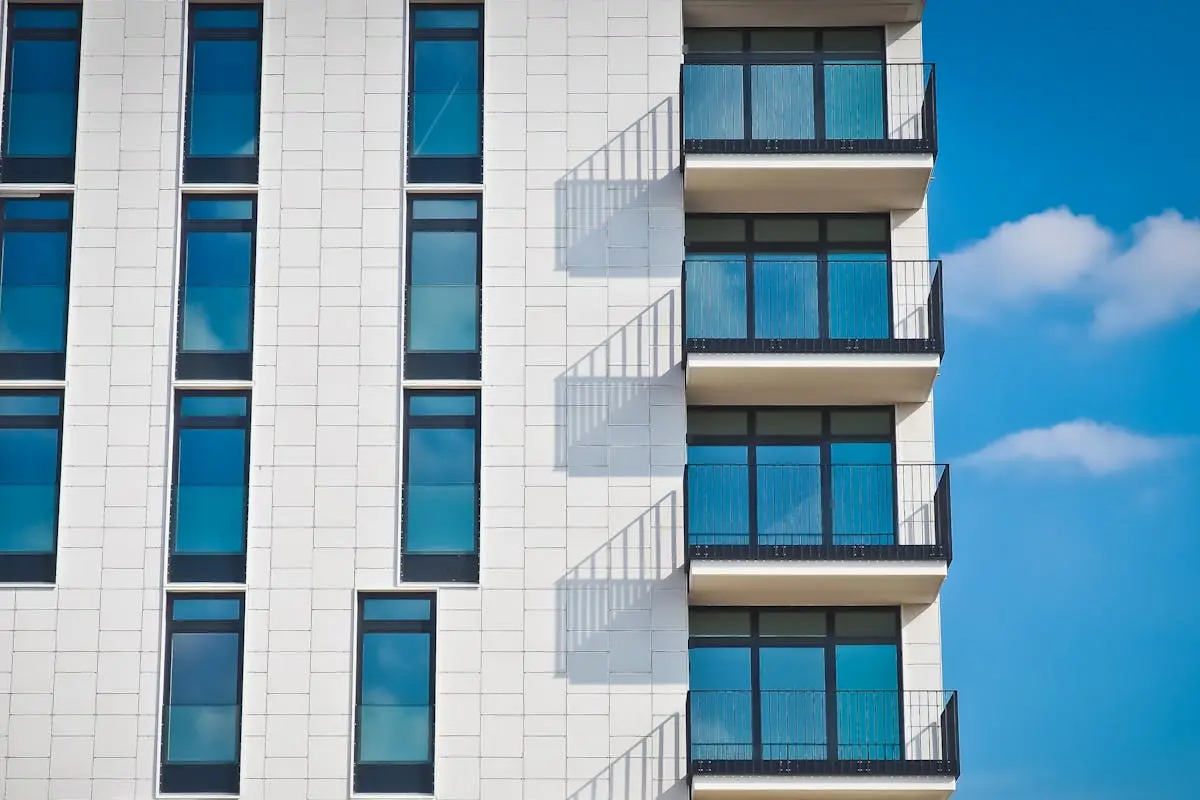 Modern apartment building exterior with balconies and contemporary architecture
