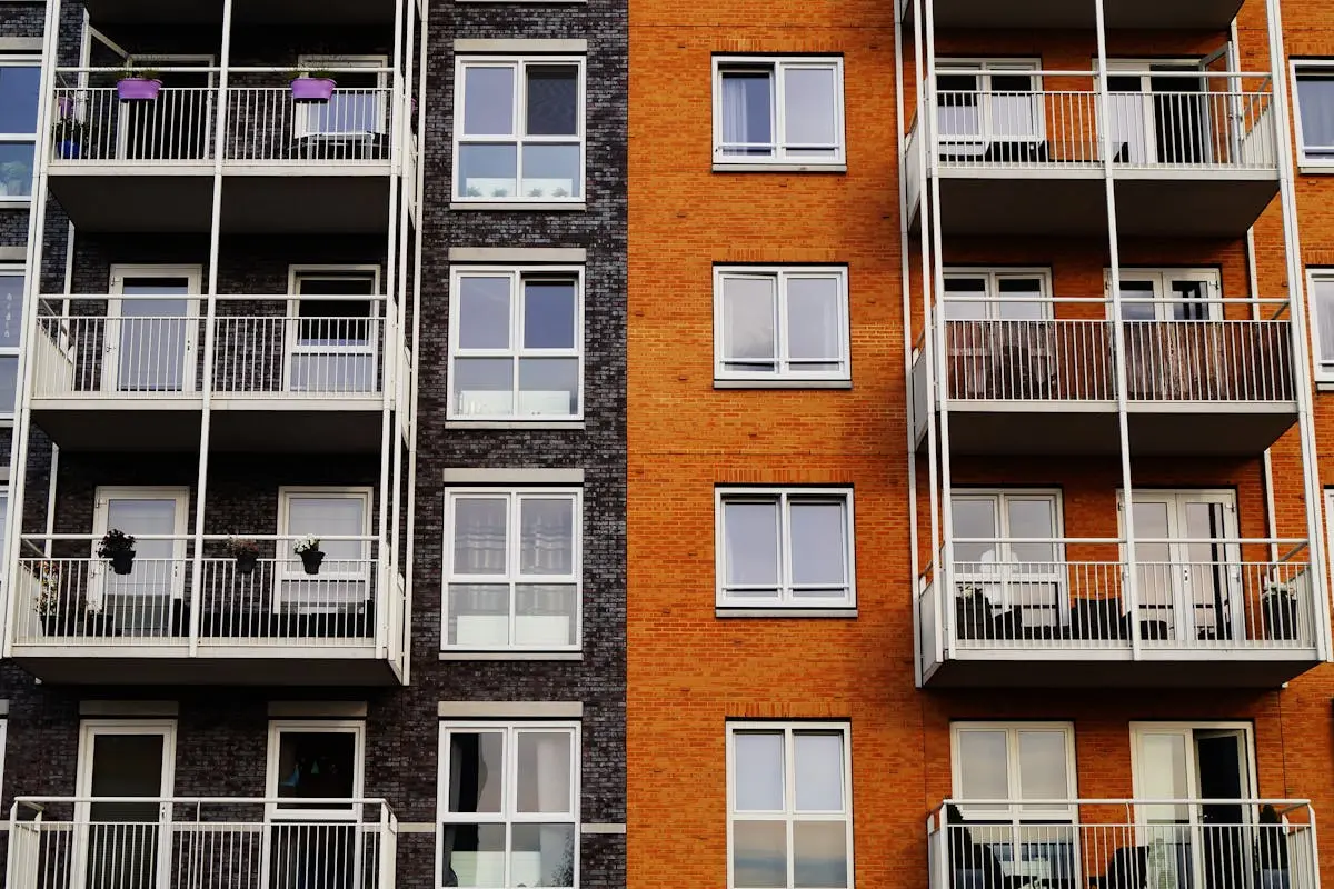 Modern multi story apartment building with balconies and residential units