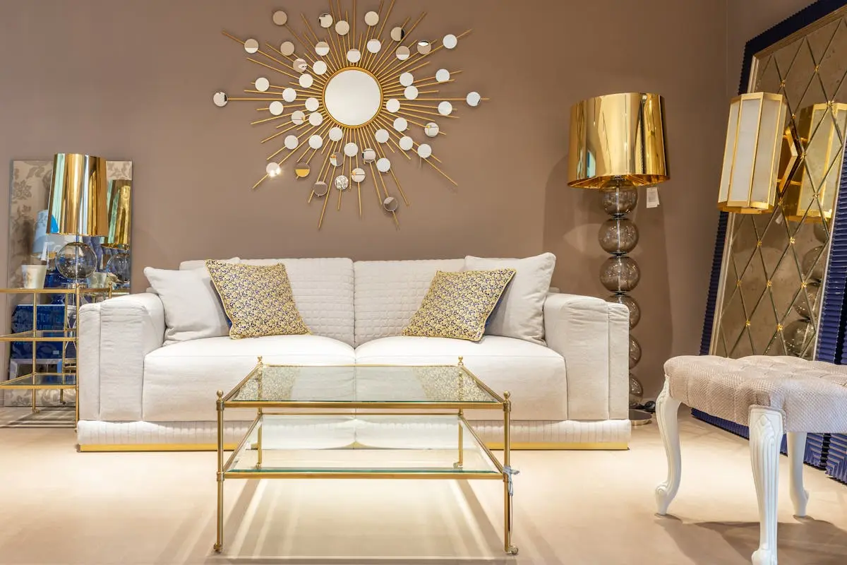 Luxury furnished living room with upscale décor and gold accent finishes