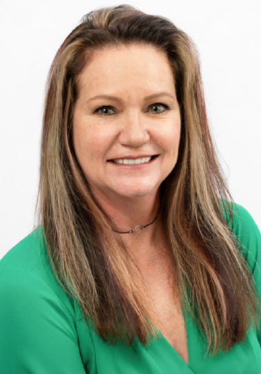 Professional headshot of Tina Queene, Director of Operations at Luxury Corporate Lodging, smiling against a clean white background.