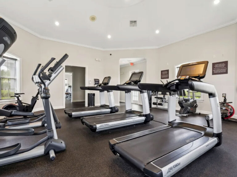 Fitness center at Ballantrae Apartments with treadmills, cardio equipment, and resident gym amenities