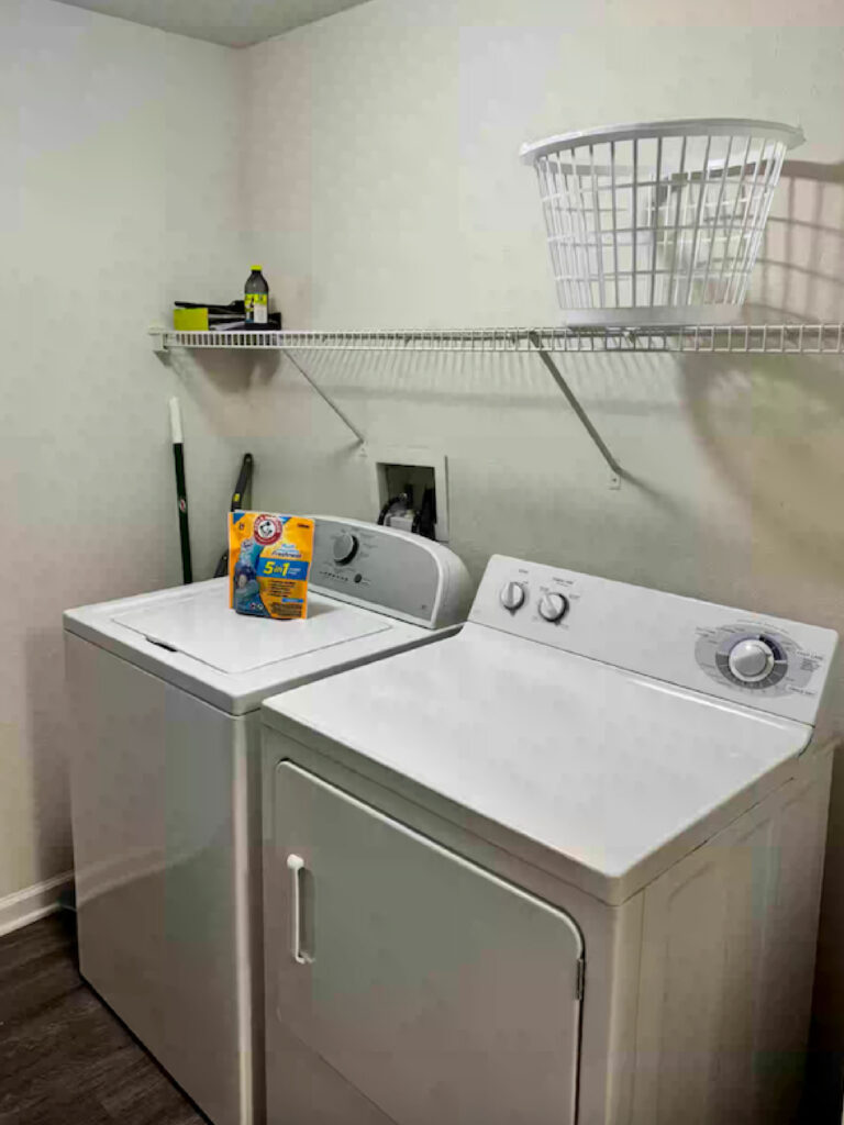 Laundry room at Ballantrae Apartments with full size washer and dryer included in furnished extended stay apartment