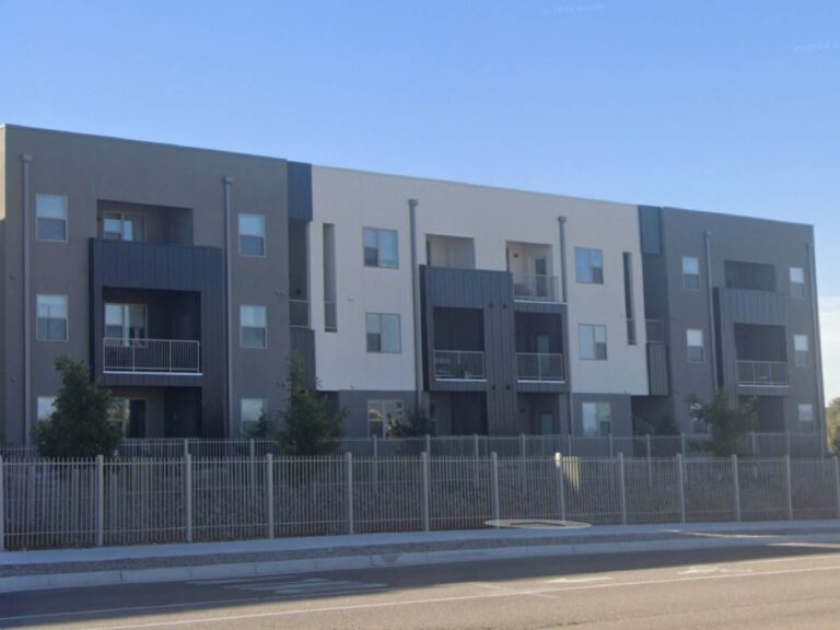 Modern three-story apartment community featuring private balconies, contemporary architecture, and professionally maintained grounds.