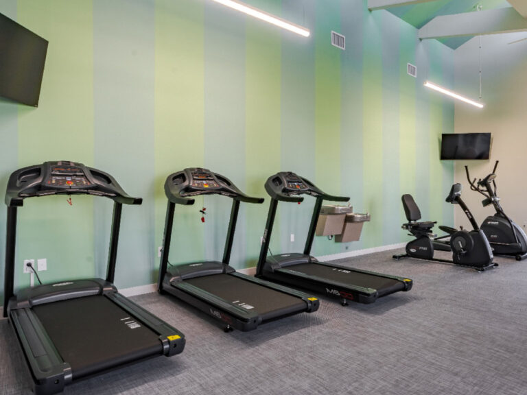 Modern fitness center at Dream Winter Haven furnished apartment community in Winter Haven Florida