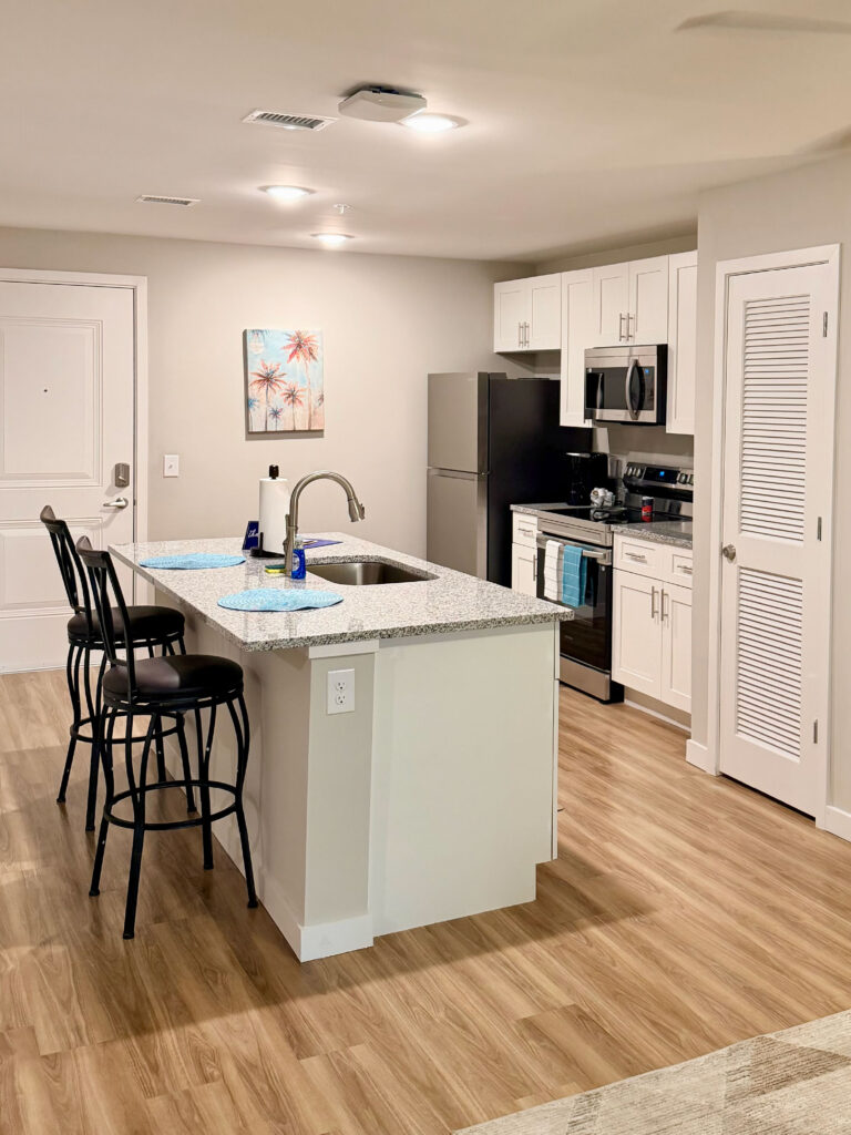 Modern kitchen and dining area at Dream Winter Haven furnished apartment community in Winter Haven Florida