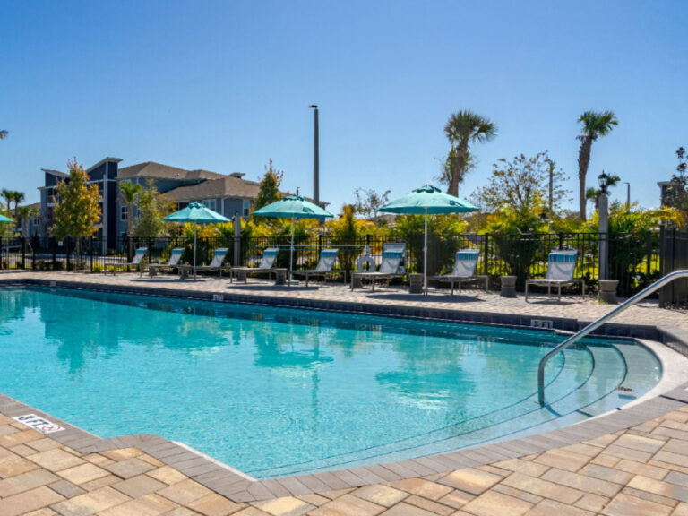 Resort style swimming pool at Dream Winter Haven furnished apartment community in Winter Haven Florida