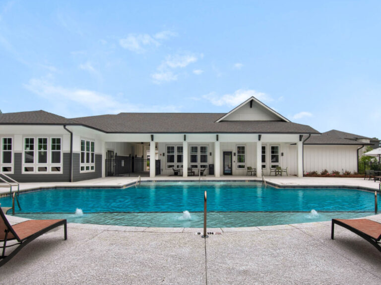 Residents at Exchange at Blair Stone can enjoy a modern outdoor grilling station featuring a built in stainless steel barbecue grill, countertop prep space, and a peaceful wooded backdrop. The amenity creates a relaxing setting for outdoor dining, entertaining, and enjoying Florida evenings.