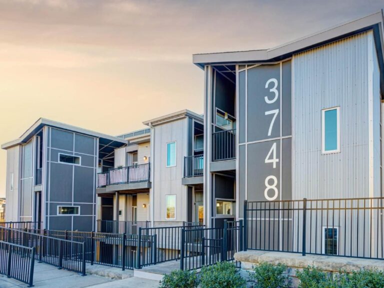 Modern apartment community exterior featuring contemporary architecture, private balconies, secure access points, and professionally maintained grounds in Nashville.