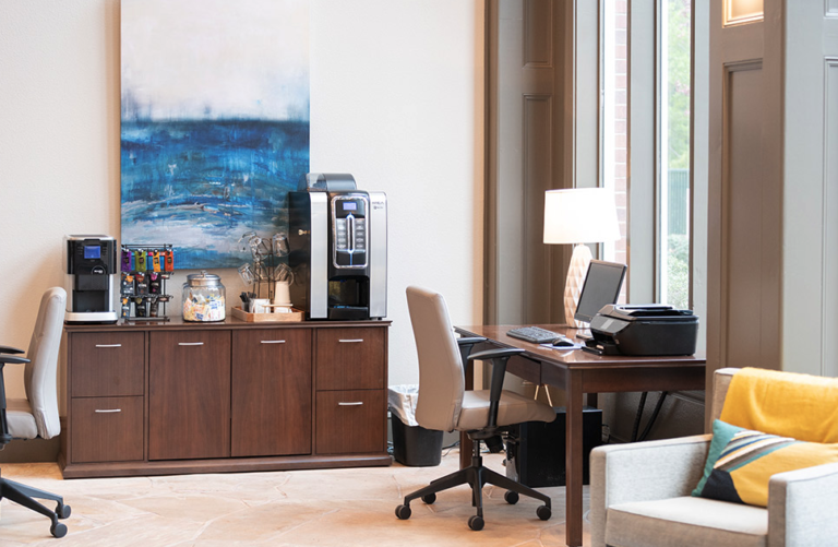 Business center at Waterford Crossing in Nashville featuring workstations, computer access, printing services, coffee station, and comfortable seating within the resident clubhouse.